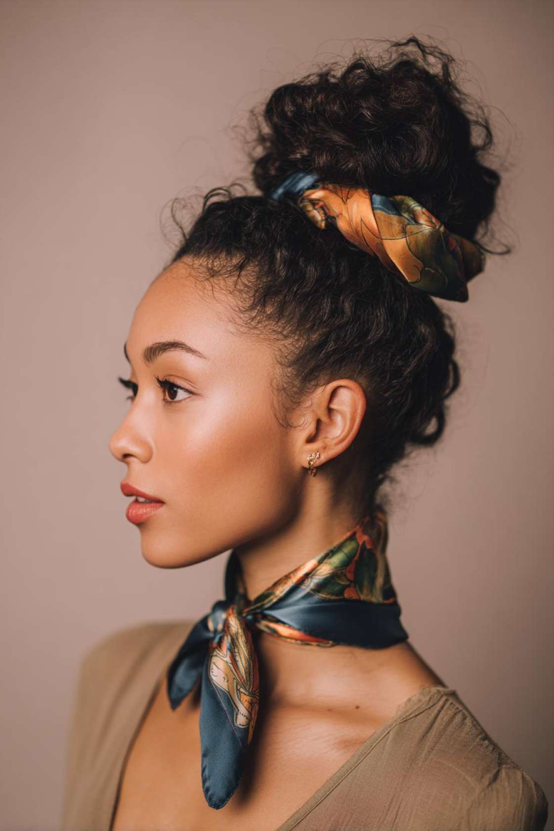 19+ Cute Ways to Wear Your Hair Up (Top Knots & Face-Framing Looks!) - 10. High Bun with a Scarf