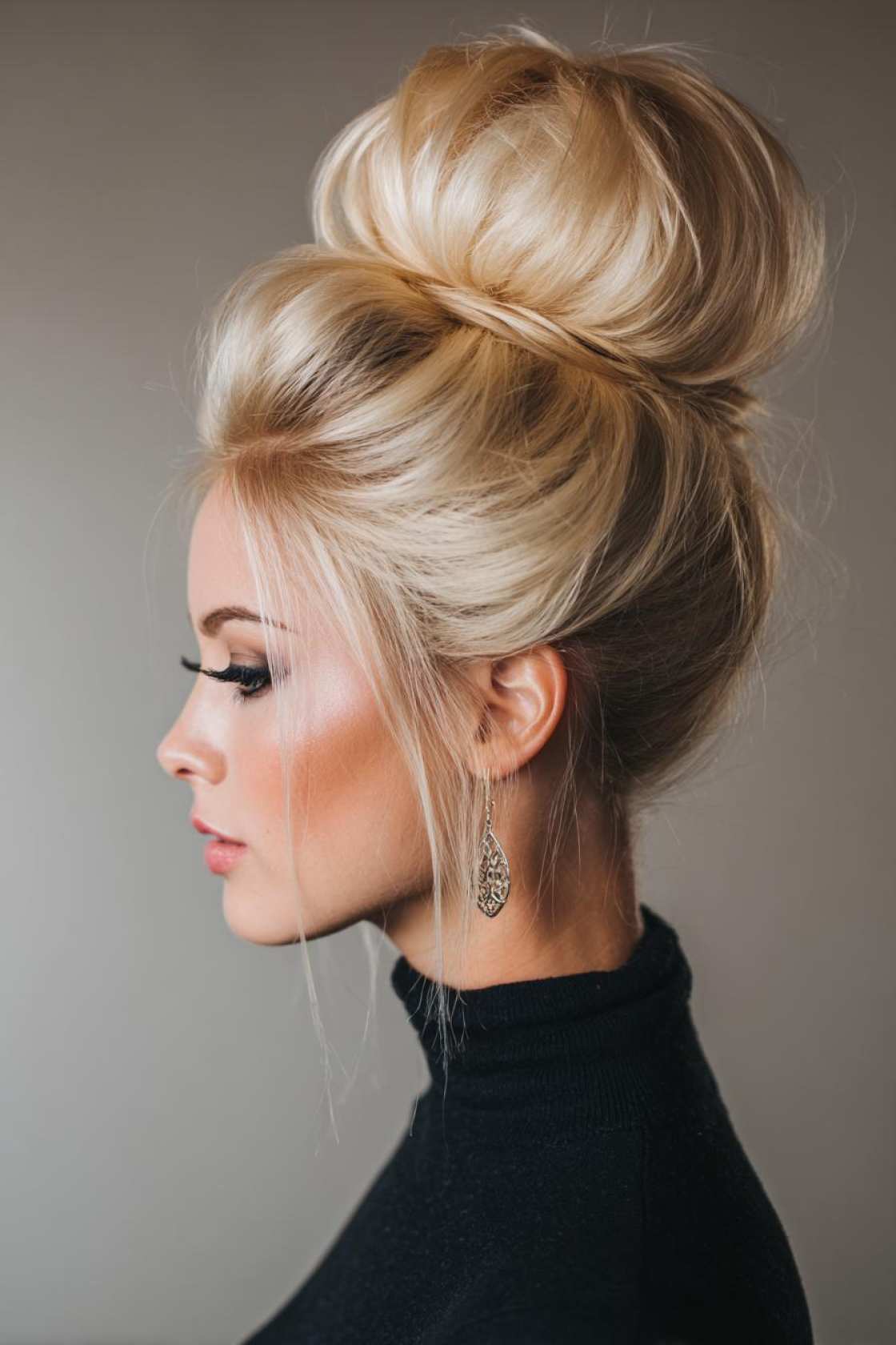 19+ Cute Ways to Wear Your Hair Up (Top Knots & Face-Framing Looks!) - 5. Voluminous High Bun