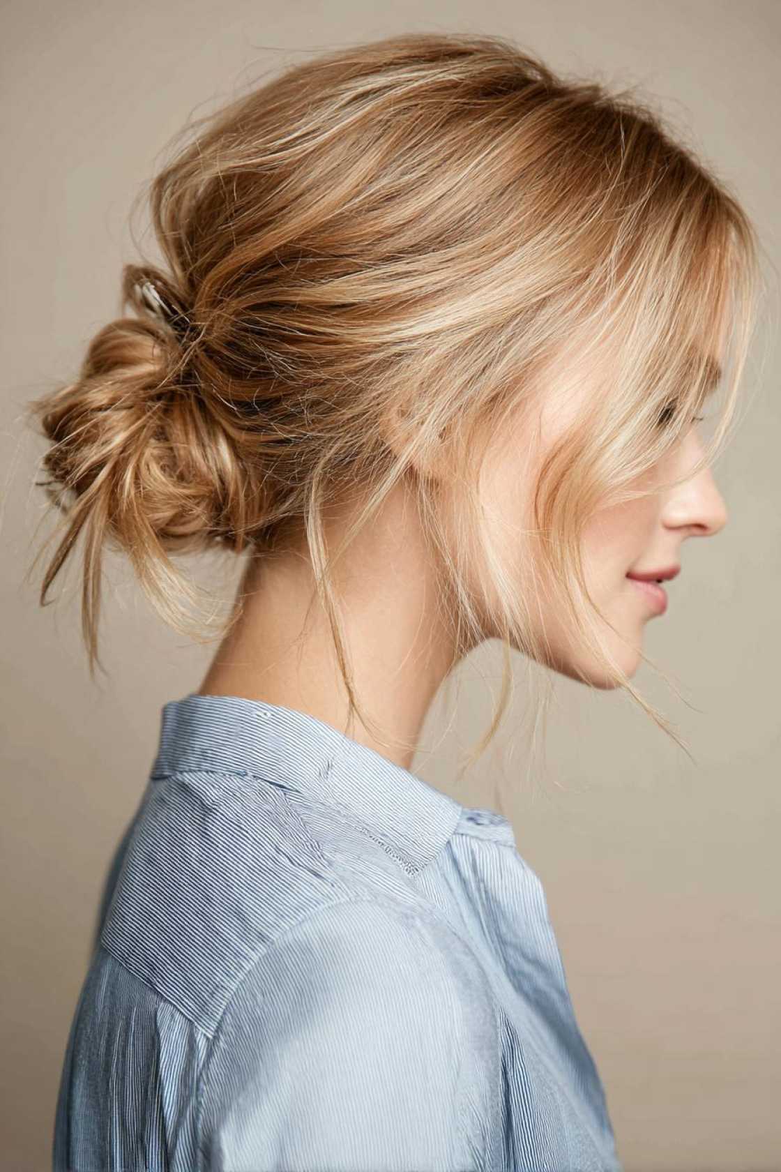 23+ Effortless Messy Claw Clip Hairstyles (Quick Twists & Buns!) - 23. Low Bun with Face-Framing Pieces