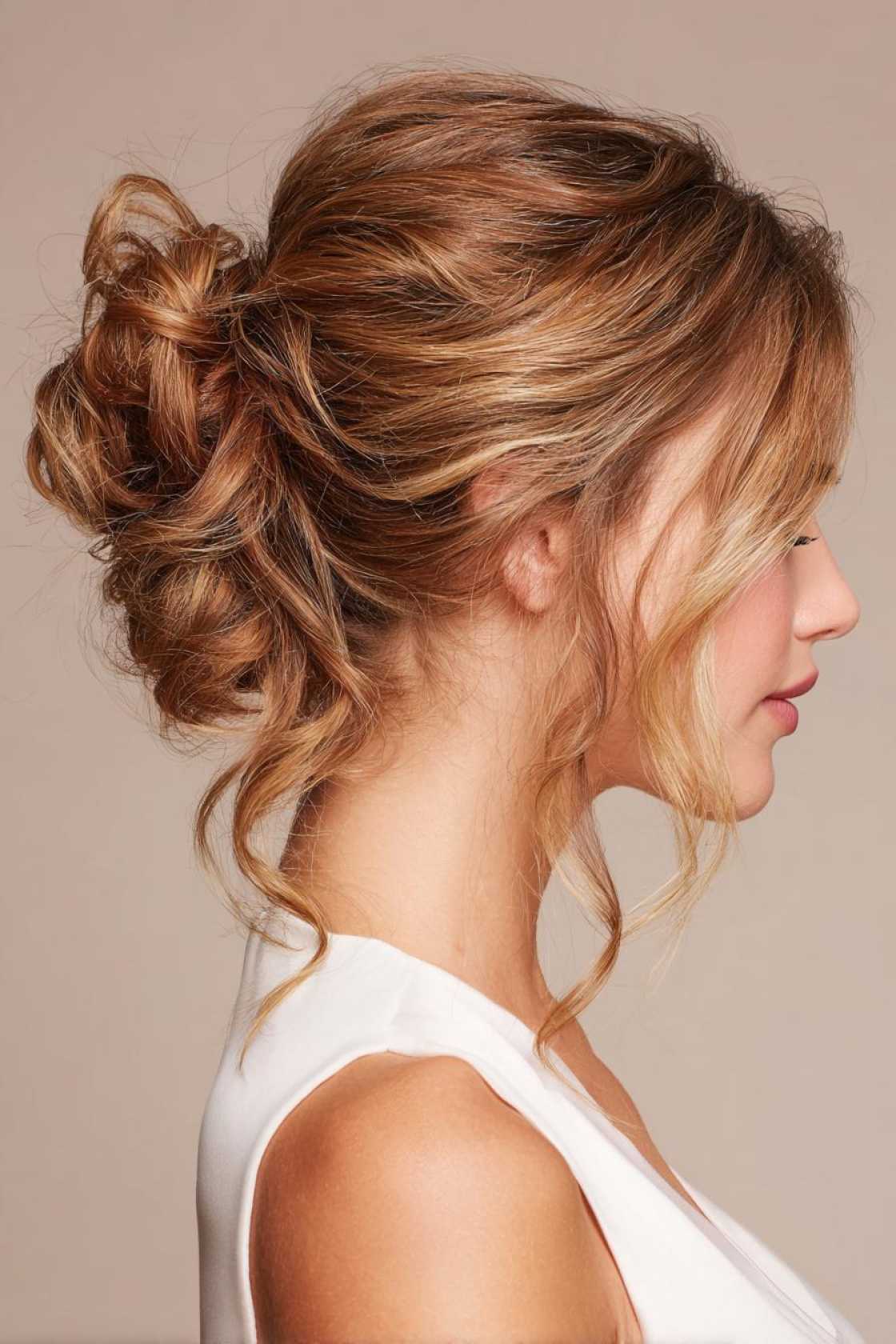 23+ Effortless Messy Claw Clip Hairstyles (Quick Twists & Buns!) - 5. Pulled-Through Bun