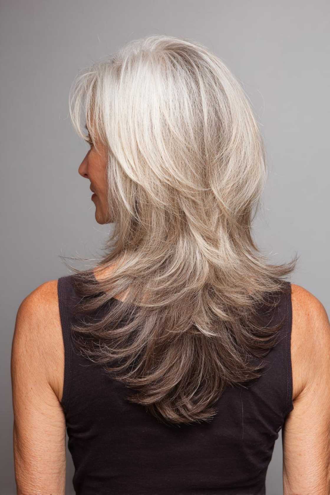Beyond the Bob: 18+ Dynamic Very Layered Medium Hairstyles for a Modern Over-50 Look. - 9. The V-Cut Layers