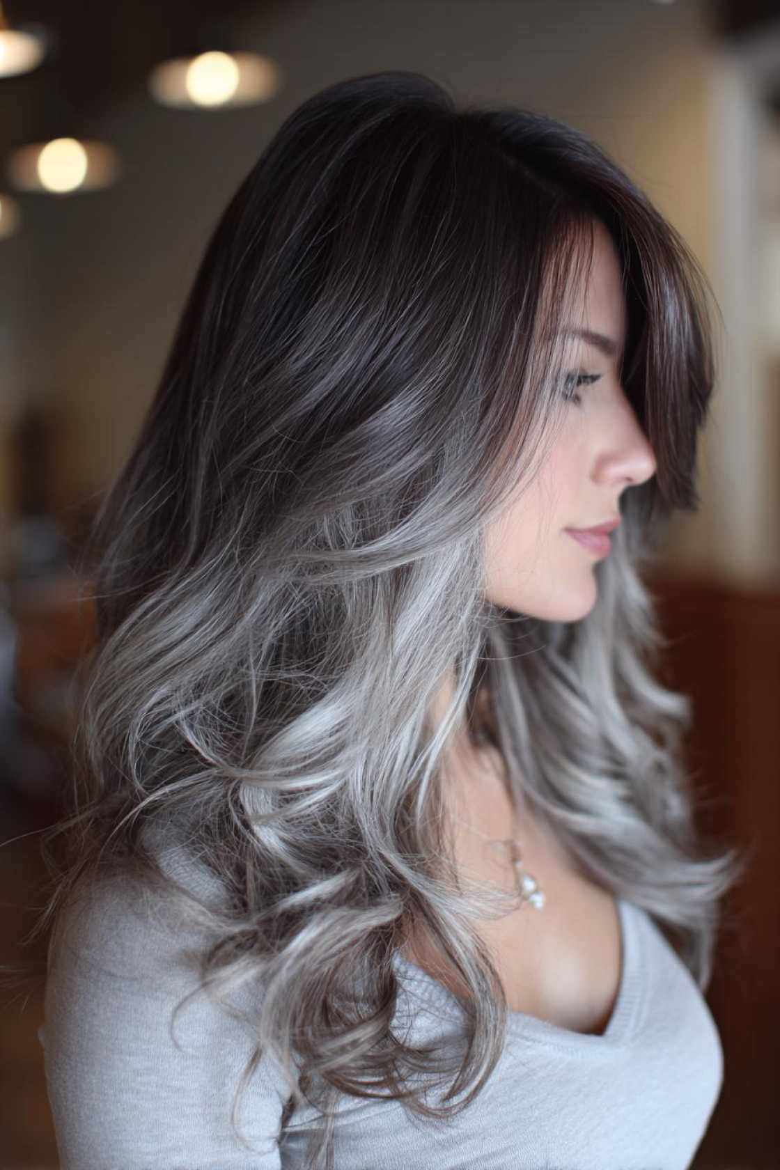Low-Maintenance Magic: 20+ Gray Blending Looks for Dark Hair That Grow Out Beautifully. - 19. Cool Gray Balayage