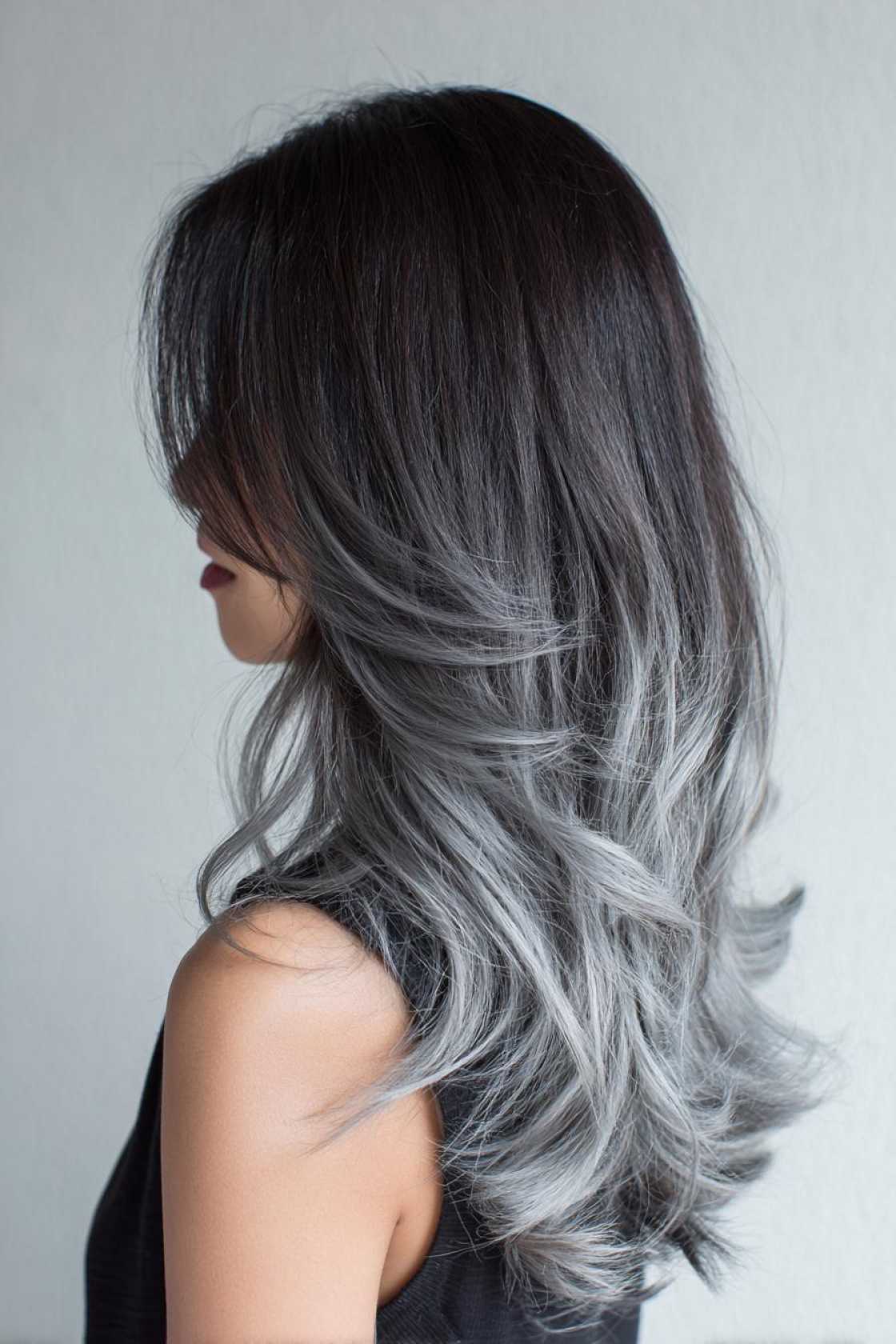 Low-Maintenance Magic: 20+ Gray Blending Looks for Dark Hair That Grow Out Beautifully. - 18. Smoky Ombre